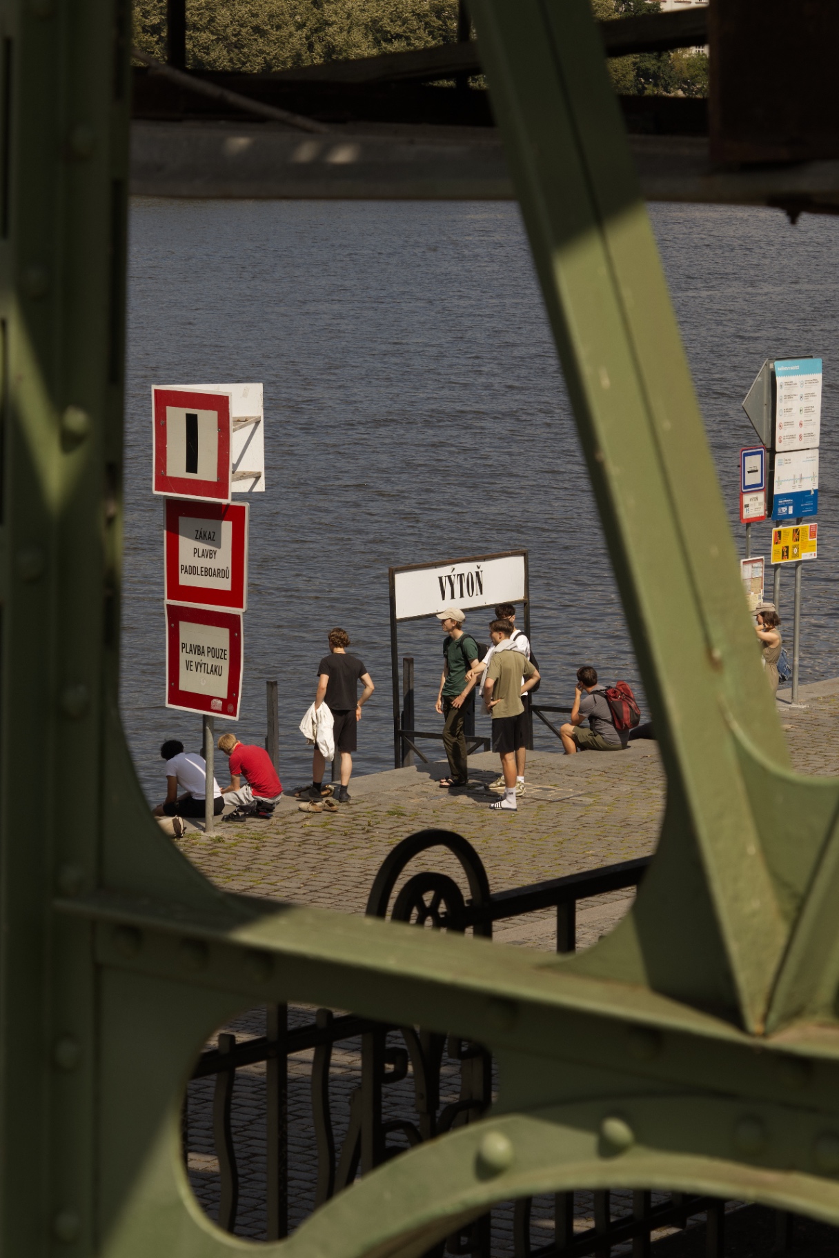 Riverbank through bridge frame